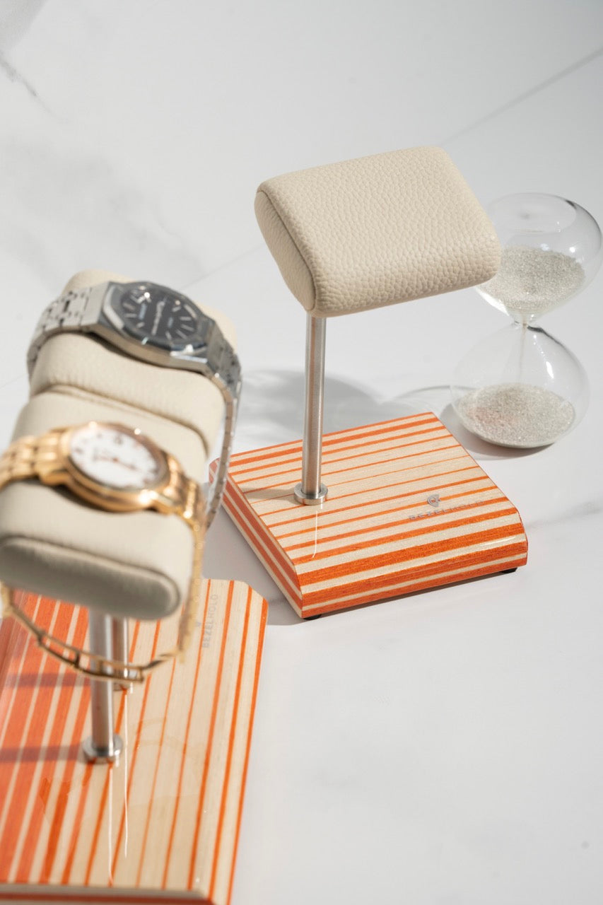 white leather and orange watch stand