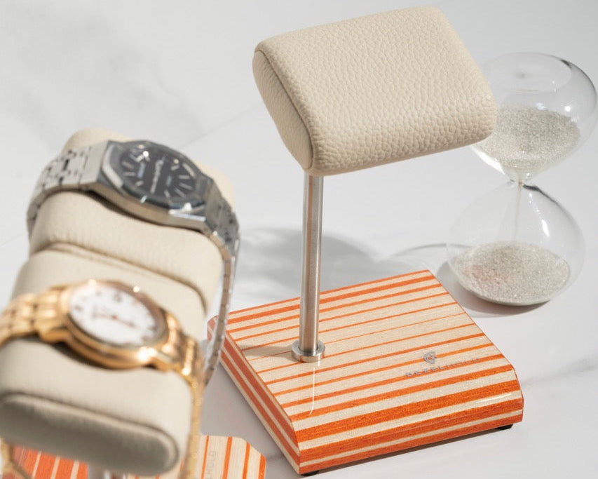 white leather and orange watch stand