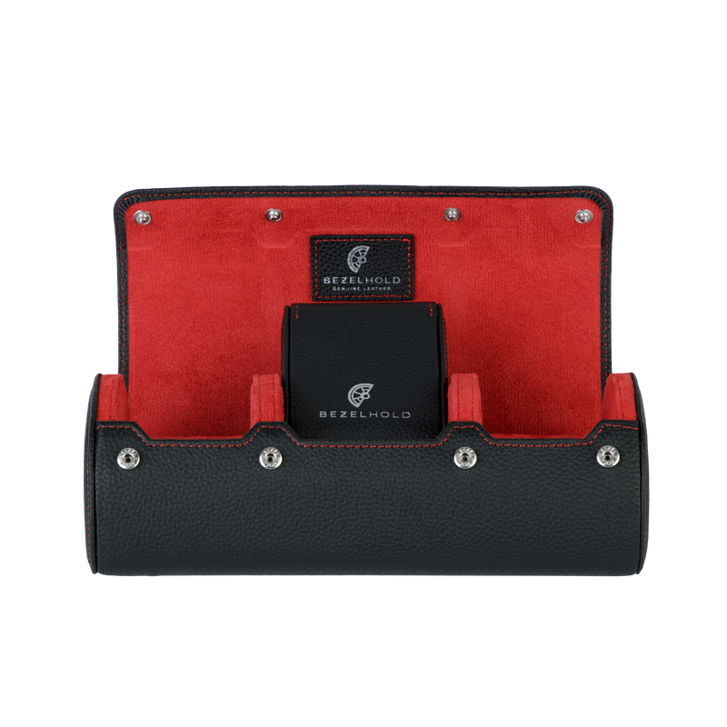 A luxury black and red leather watch case for travel and storage.