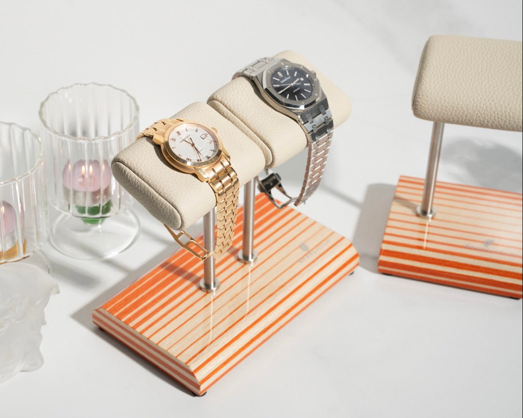 white leather and orange watch stand
