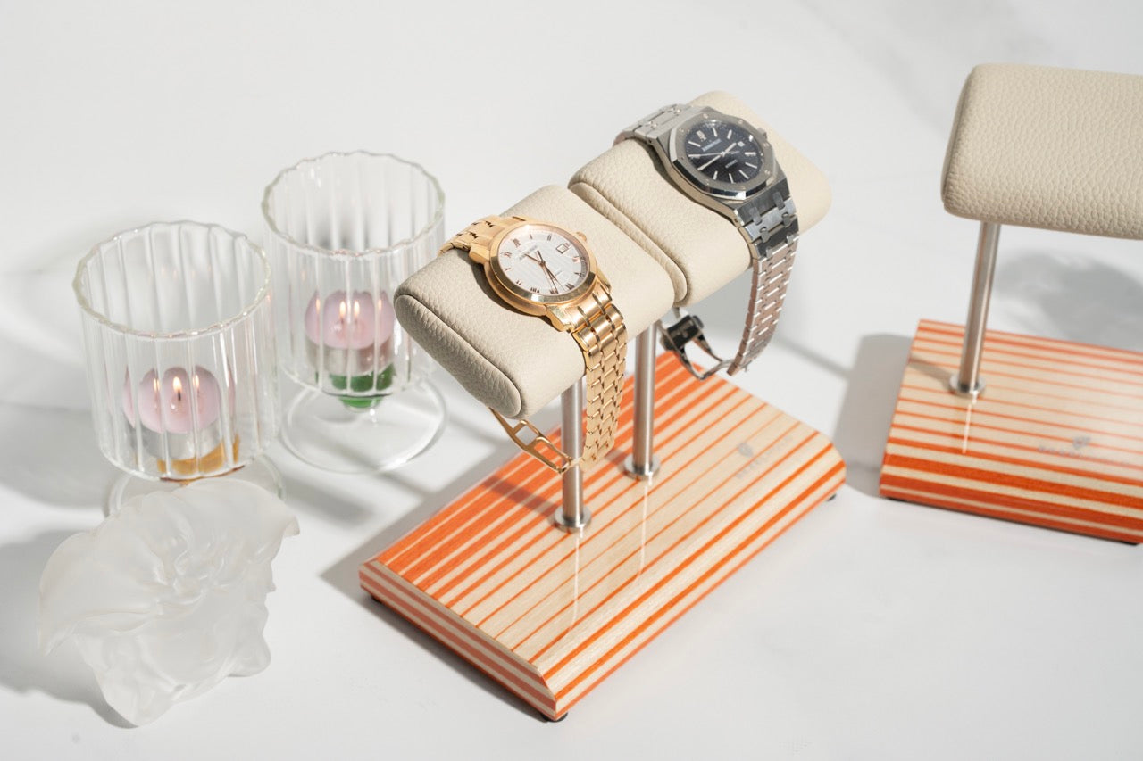 white leather and orange watch stand