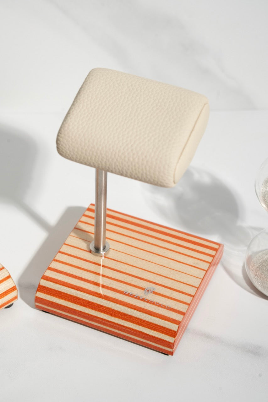 white leather and orange watch stand