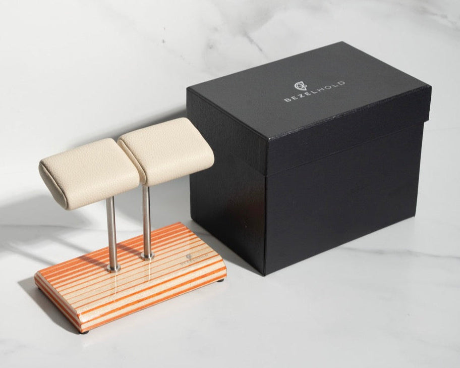 white leather and orange watch stand